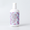 Full ingredient list and safety icons on the side of the Amra Baby Body Wash and Shampoo bottle.