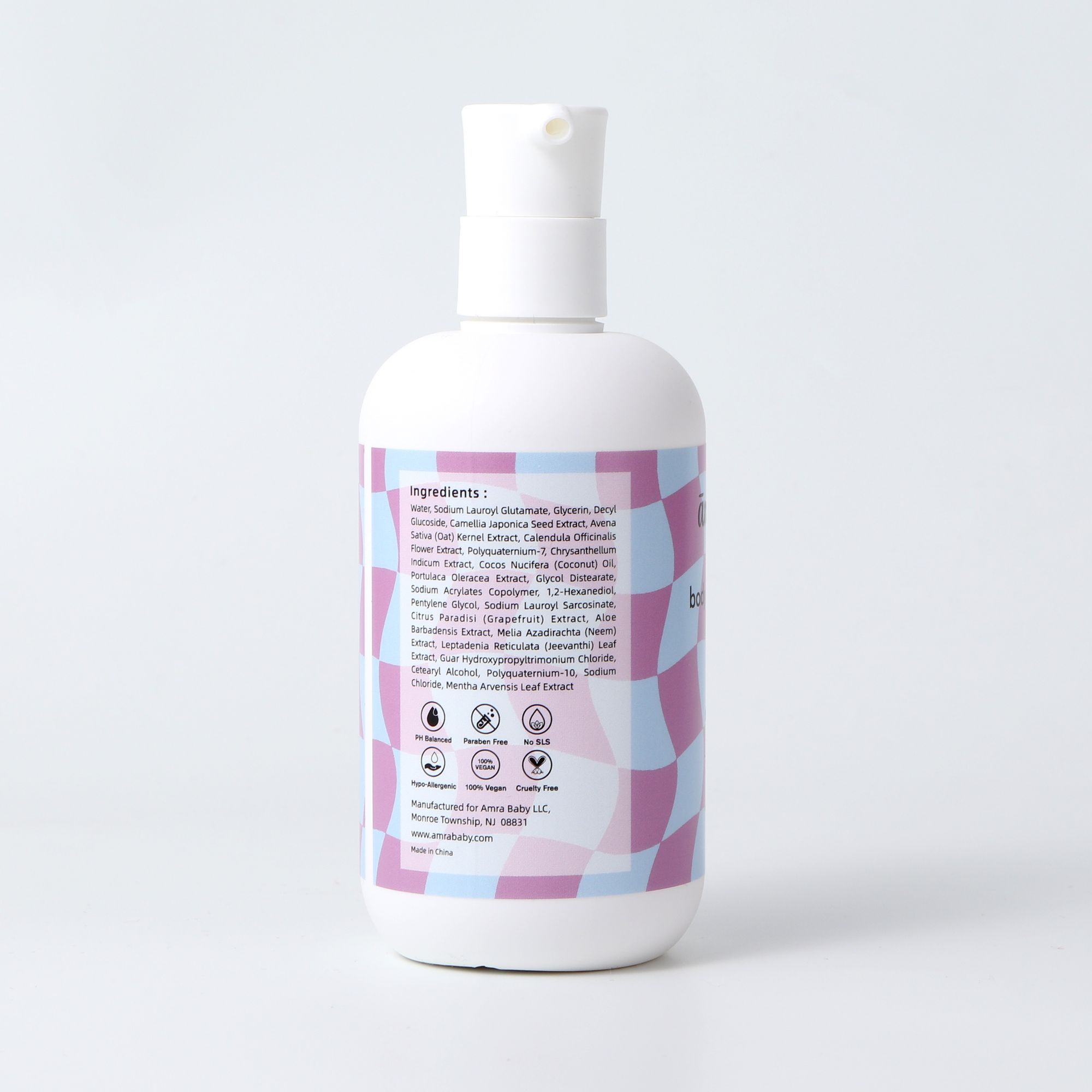Full ingredient list and safety icons on the side of the Amra Baby Body Wash and Shampoo bottle.