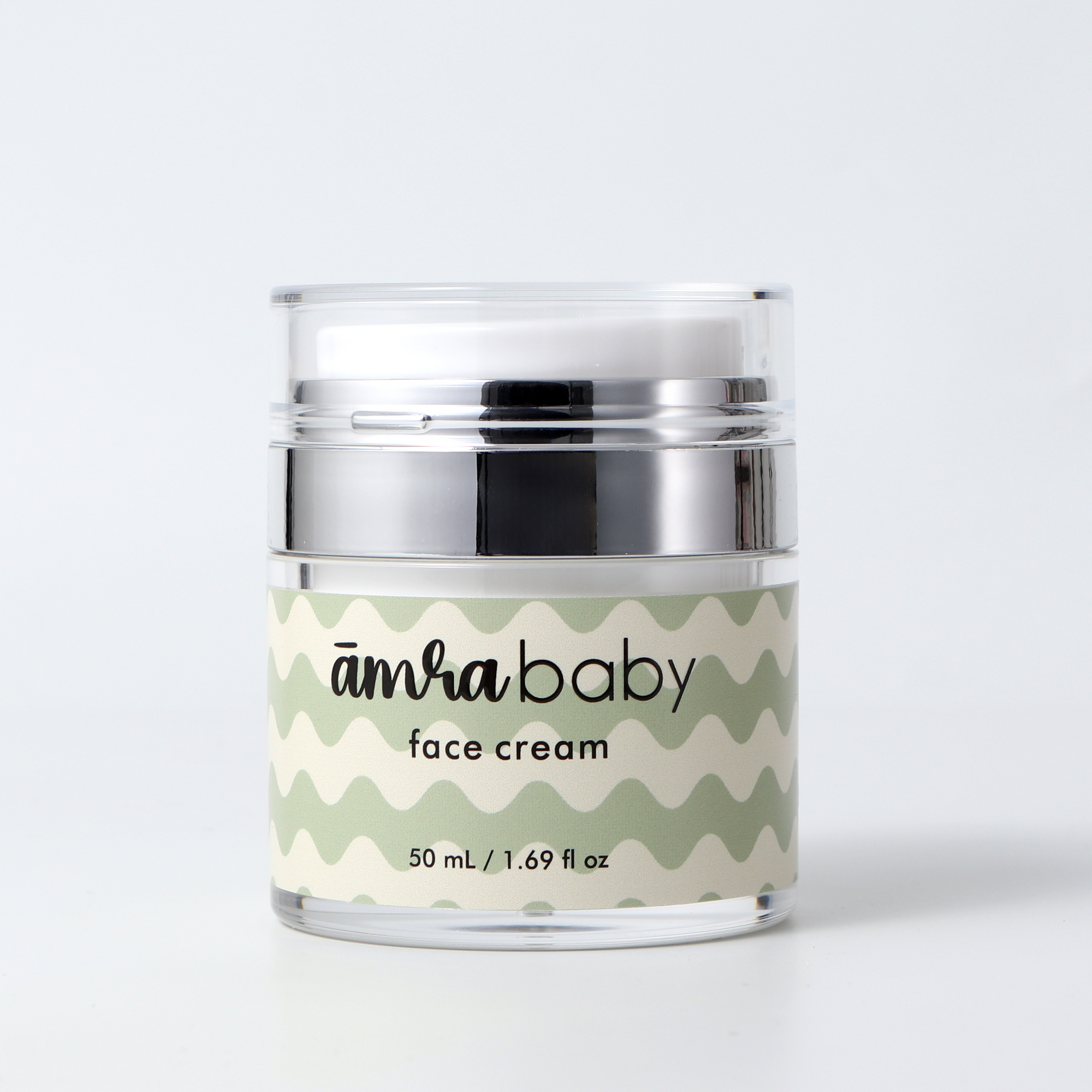 Amra Baby face cream push-top jar showing the clean airless pump dispenser